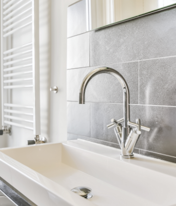 bathroom with modern sink and faucet