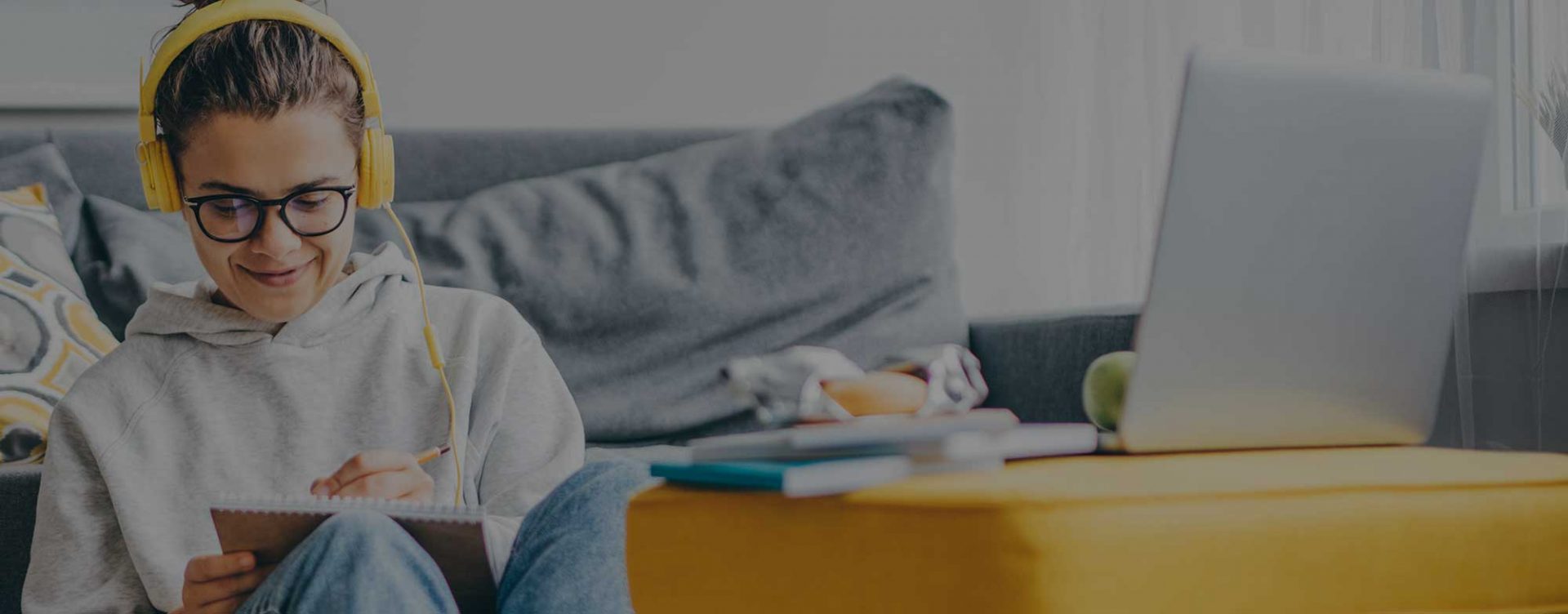 young women smiling while studying